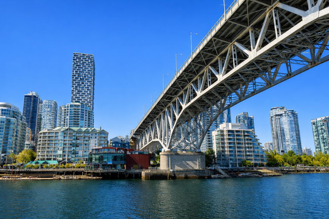 False Creek shoreline with Vancouver city skyline and waterfront promenade during a Vancouver Canada Tours sightseeing tour